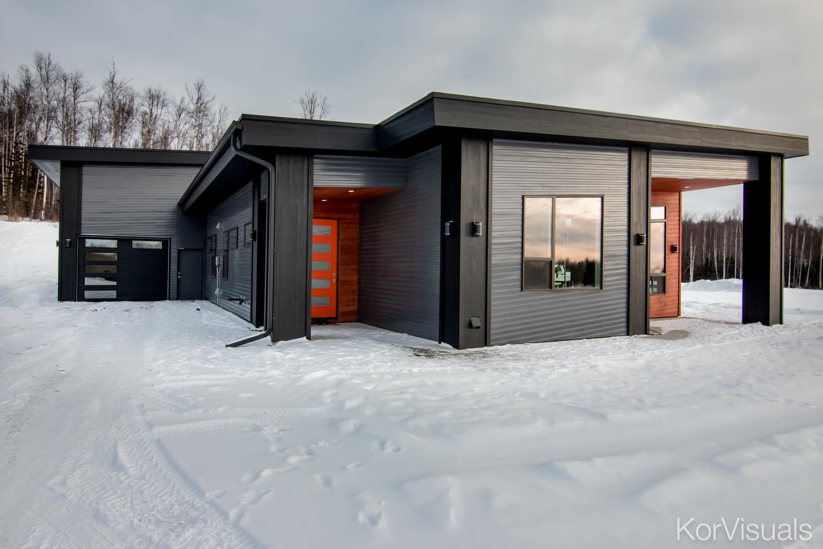 contemporary shop home with grey siding wasilla home with mountain view
