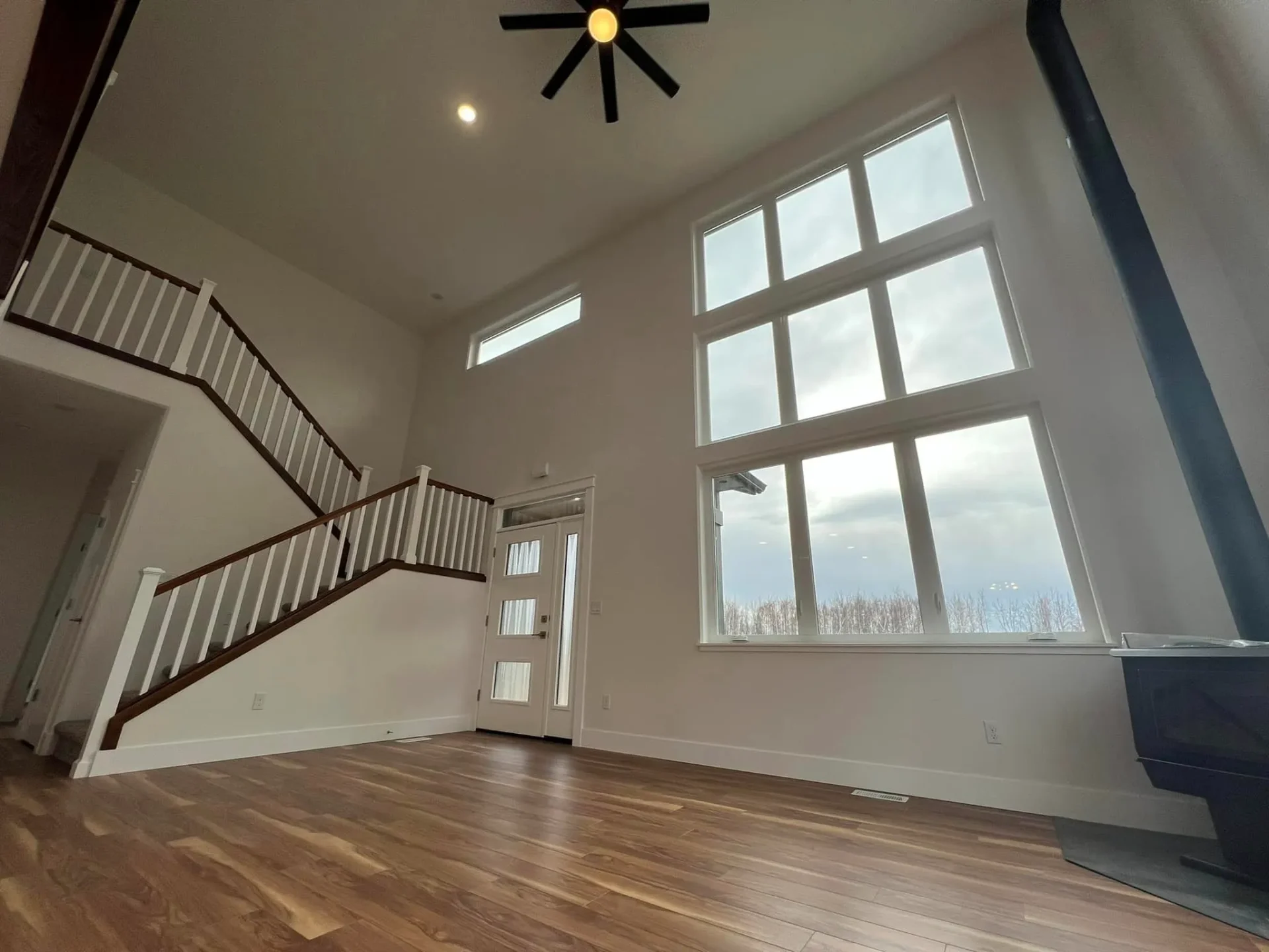 huge front windows living room of hangar home in alaska