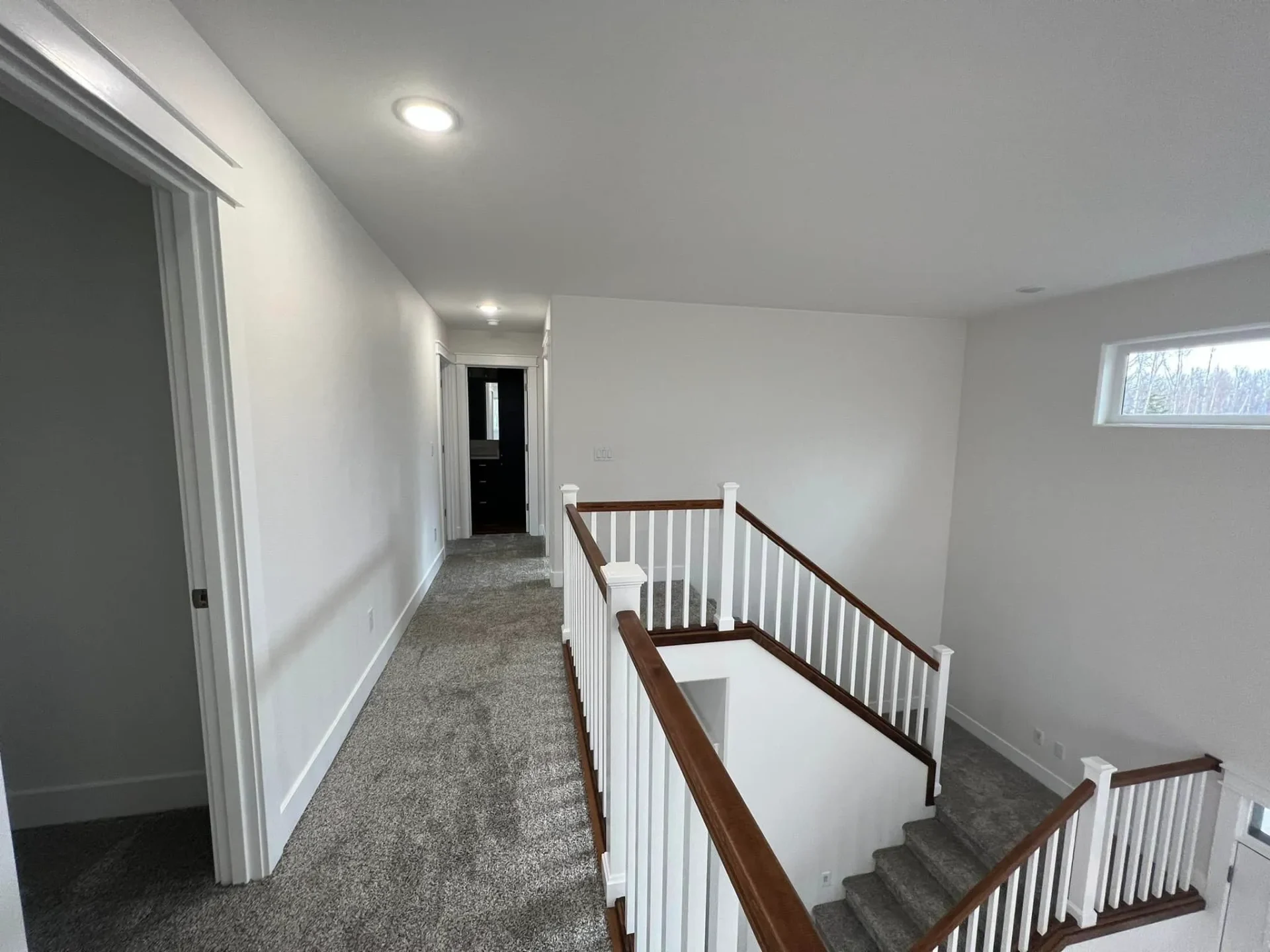 upstairs hallway by balcony hangar home in alaska